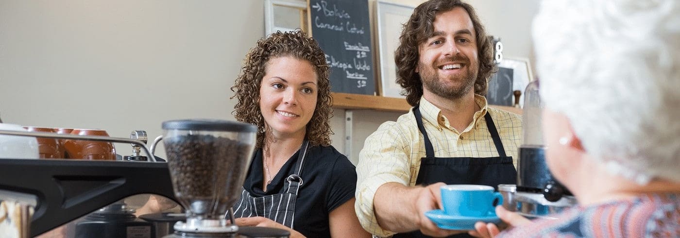 Caf&eacute; owners going over the numbers